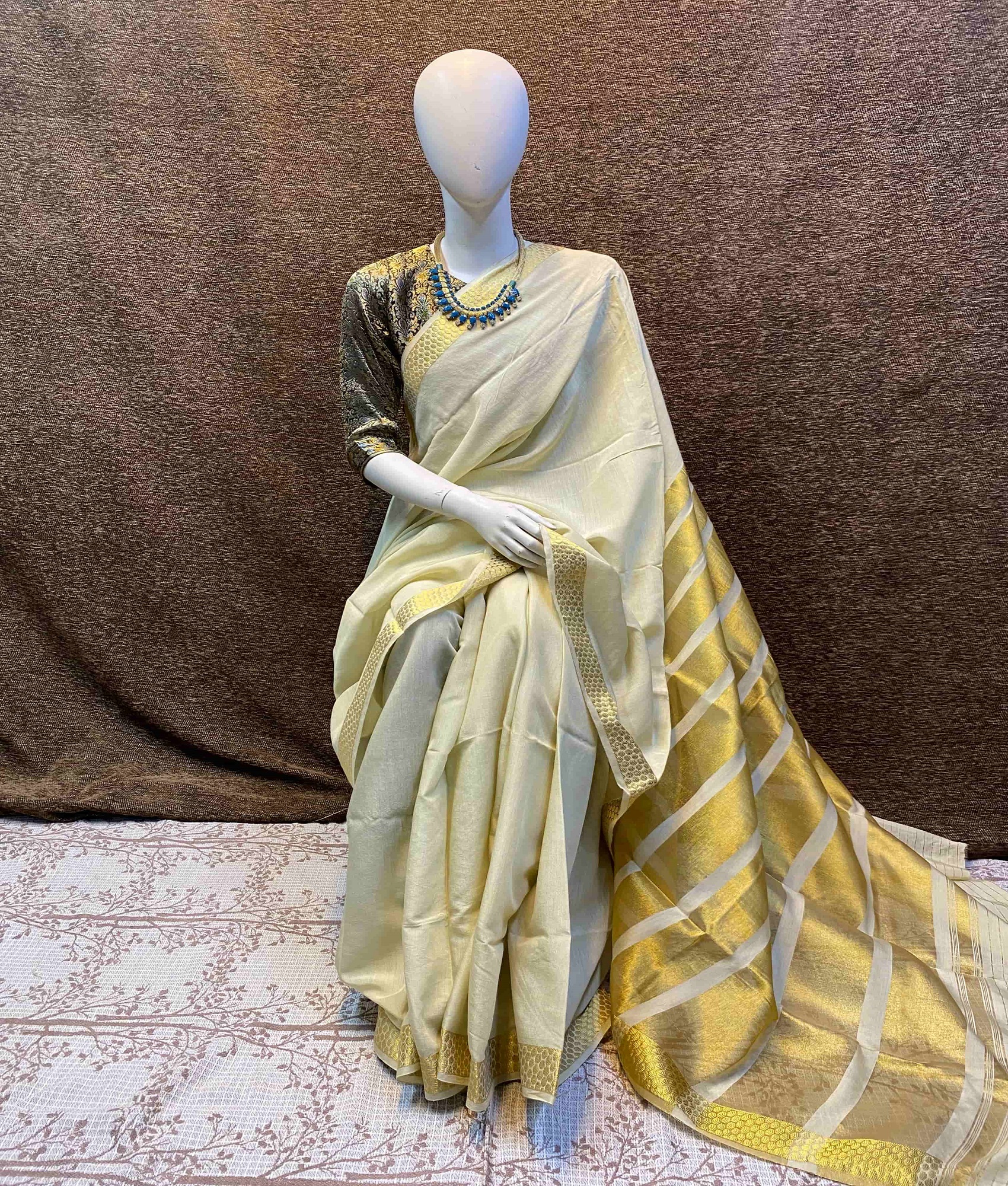 Cream plain cotton saree with gold zari striped pallu and embroidered blouse mannequin Silk Qila Pakistan